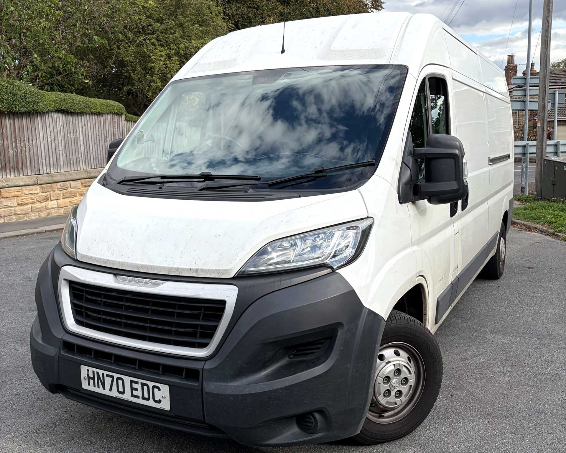 Enclave Logistics' white long-wheelbase Peugeot Boxer van, ready for a same-day delivery
